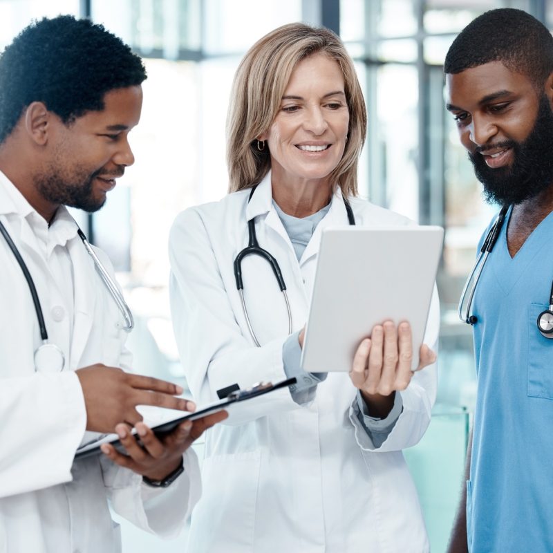Doctors, meeting and tablet for healthcare planning using information technology for medical develo